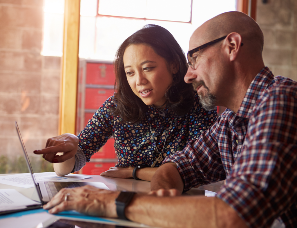 Photo of a man and a woman at a laptop