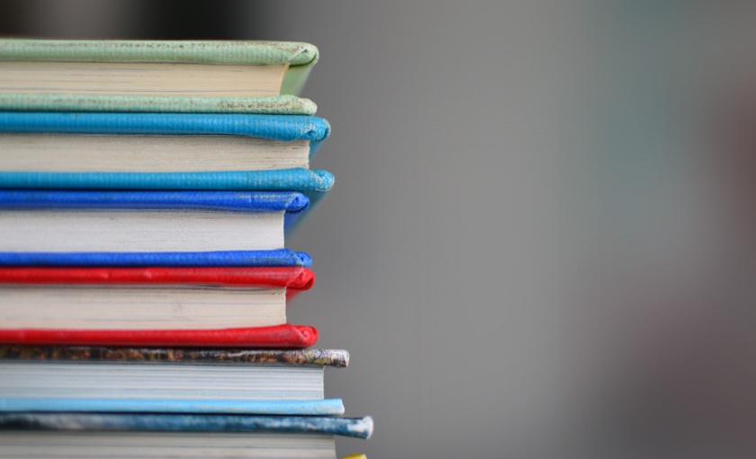 Photo showing a stack of colourful books