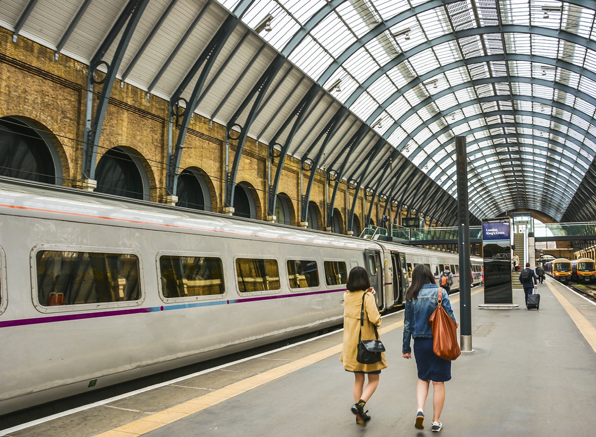 Photo showing two women walking along a platform at London King's Cross