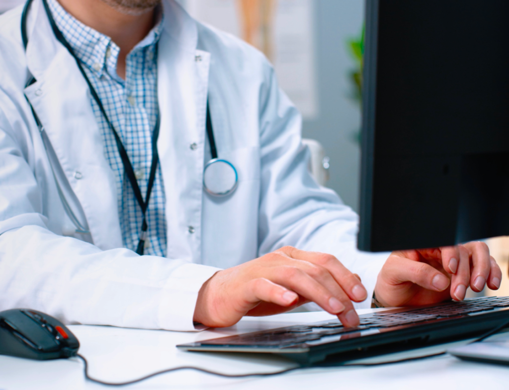 Photo showing a doctor at computer