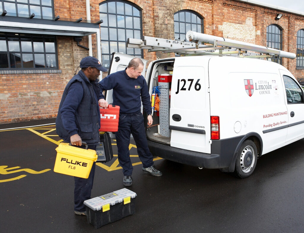 Two men loading a City of Lincoln Council van