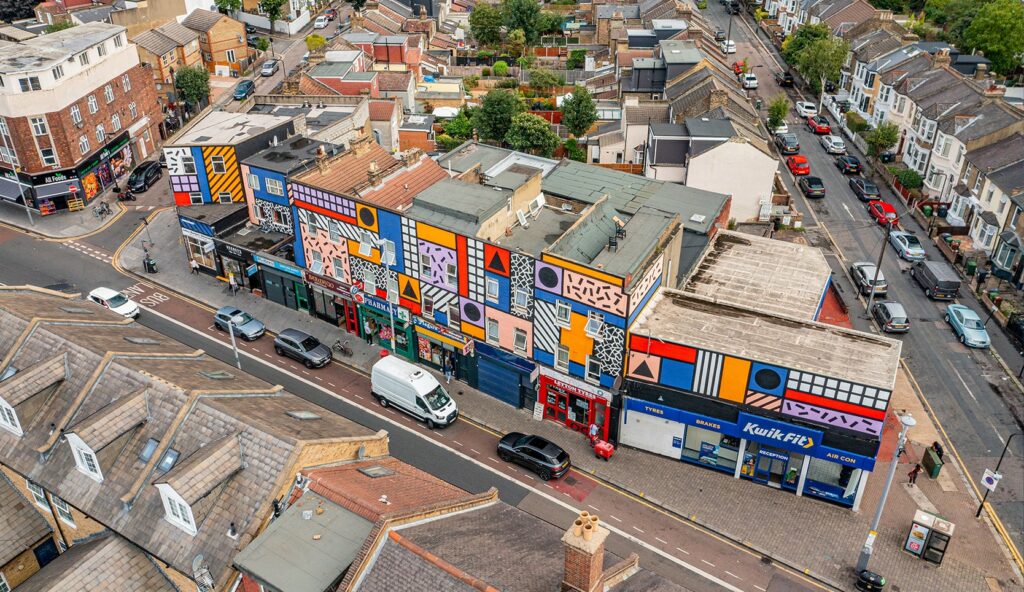 Aerial photo from a drone of Leyton High Street London, including Walala Parade artwork on building.